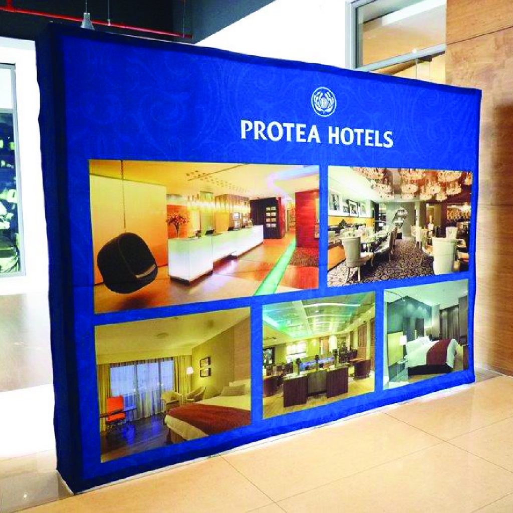 Example of a straight fabric banner wall with a folding lattice frame
